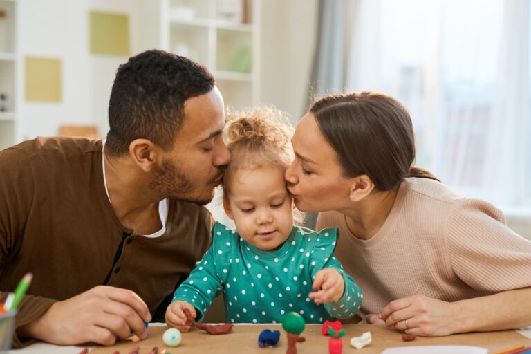 loving-parents-kissing-child.jpg